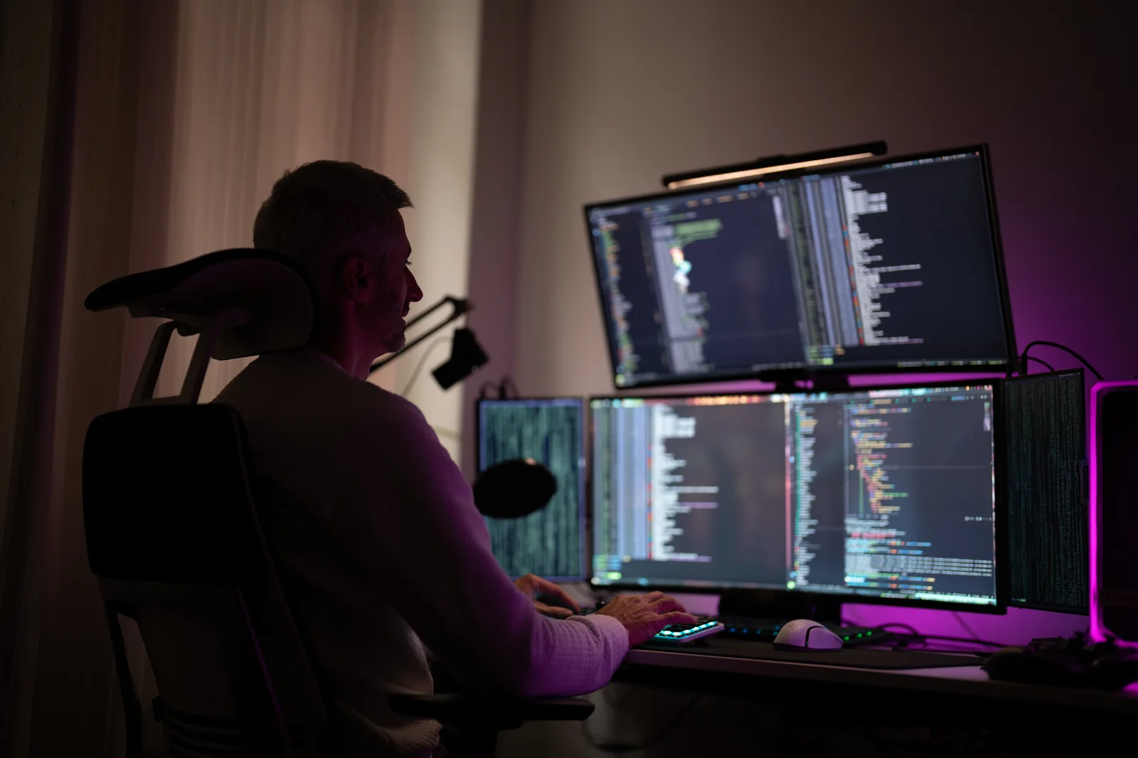 The ONEXO team at their laptops